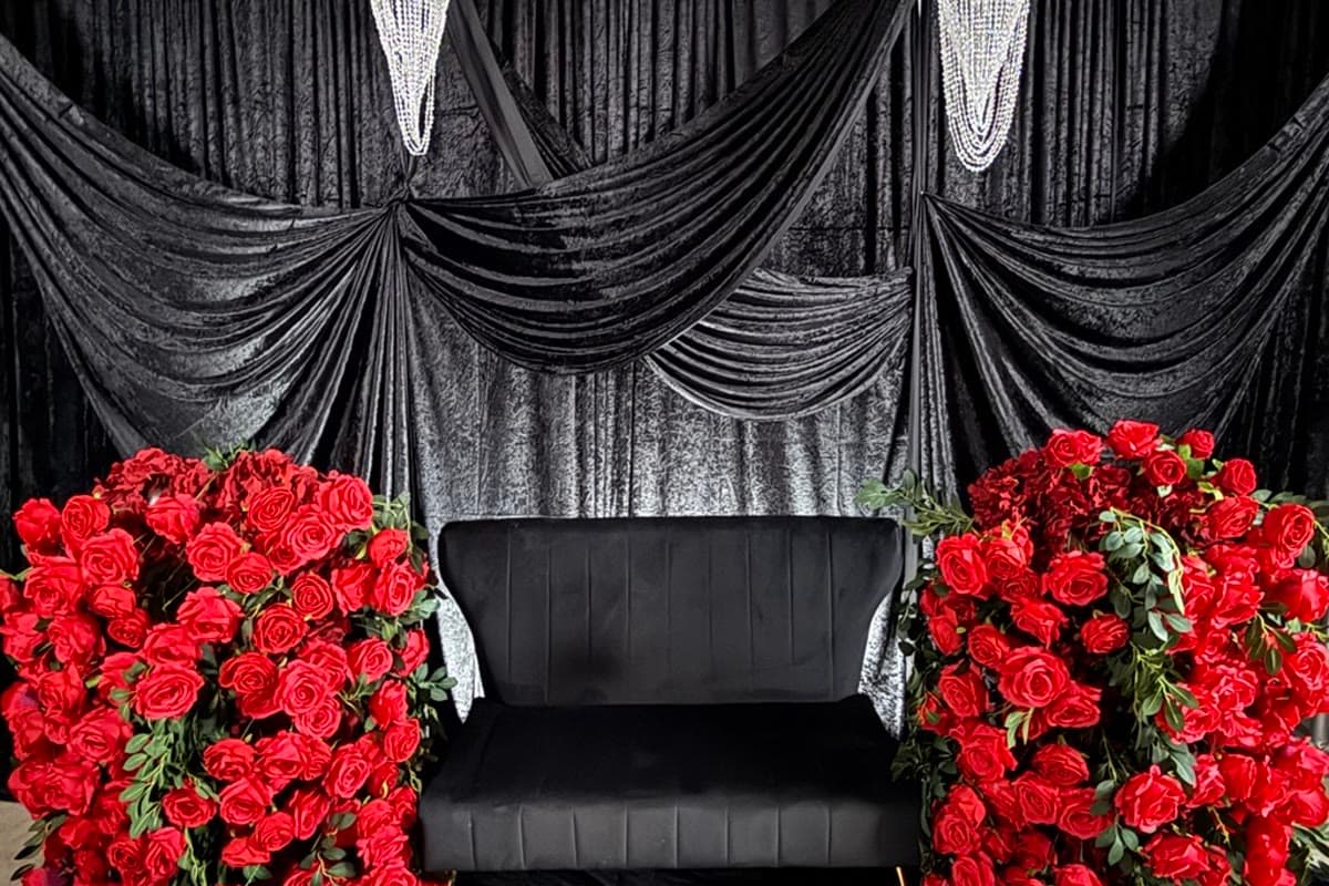 Black velvet swag backdrop with rose styling