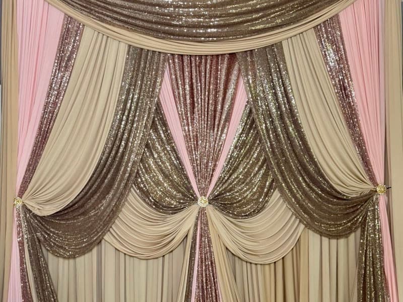 Ceremony backdrop — champagne & blush sequin drape