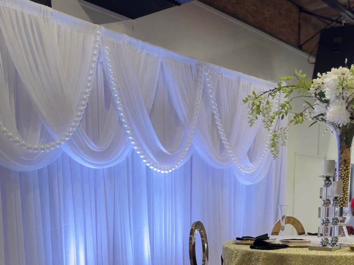 Sweetheart backdrop — white pearl swag drape